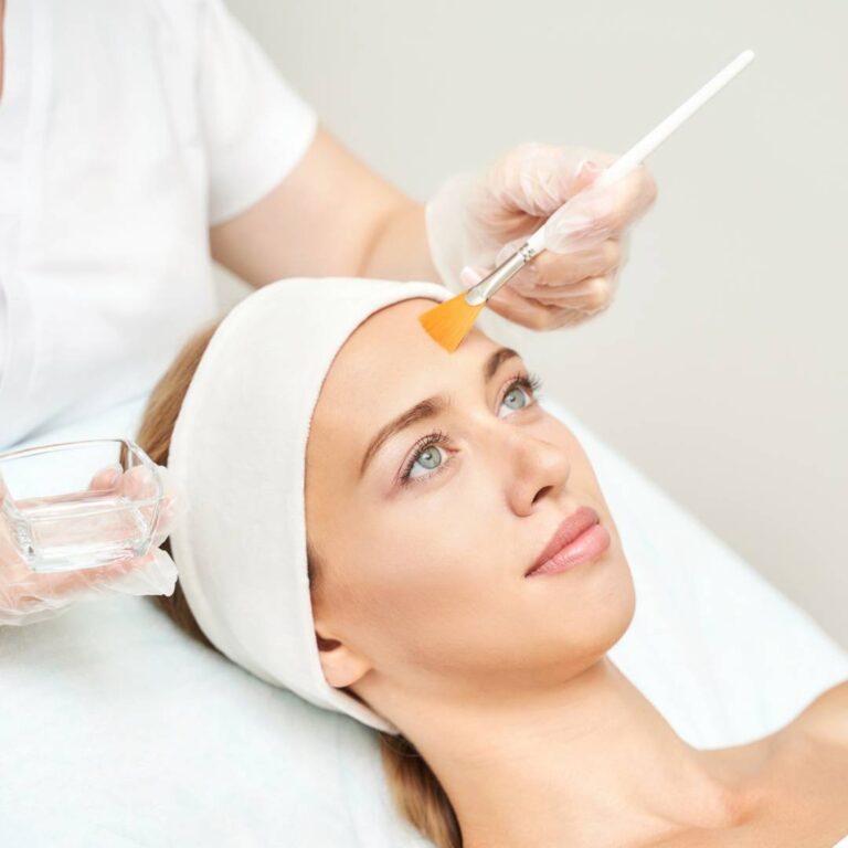 Woman getting Chemical Peel Painted On